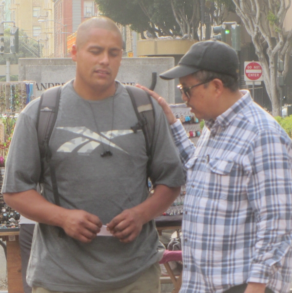 BERNIE PRAYS FOR MAN AT POWELL AND MARKET.