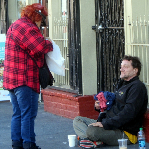 KATHY MINISTERS TO HOMELESS MAN AT 16TH AND VALENCIA ST.