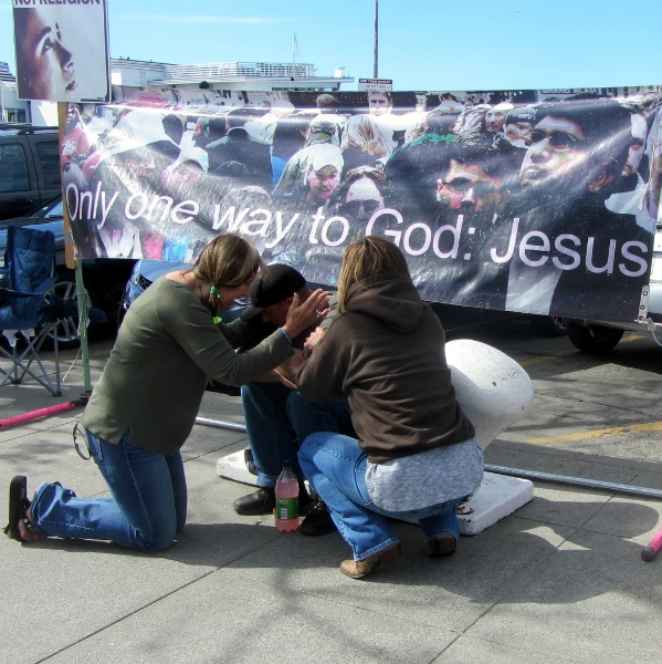 PRAYING FOR MAN AT FISHERMAN'S WHARF