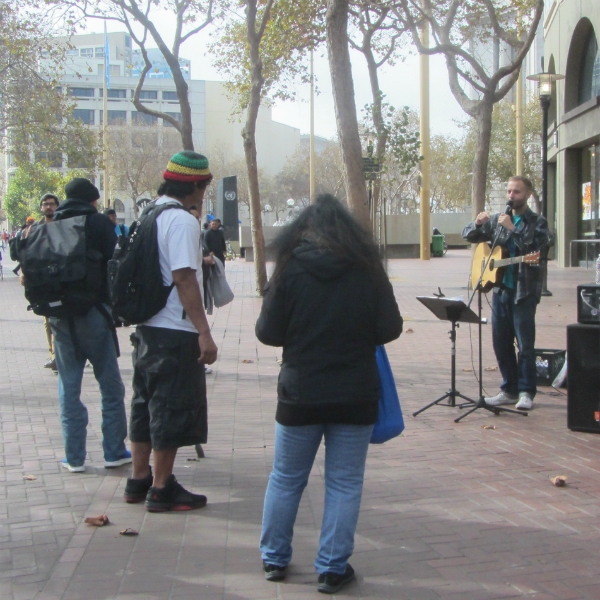 CAL SINGS AT 7TH ST AND MARKET.