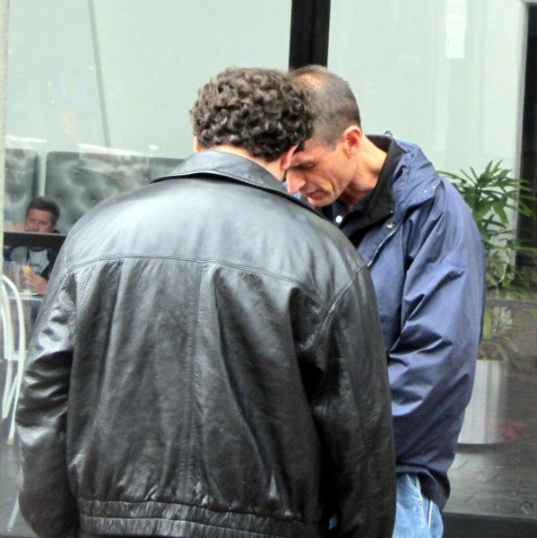 MIKE PRAYS WITH MAN IN BERKELEY.