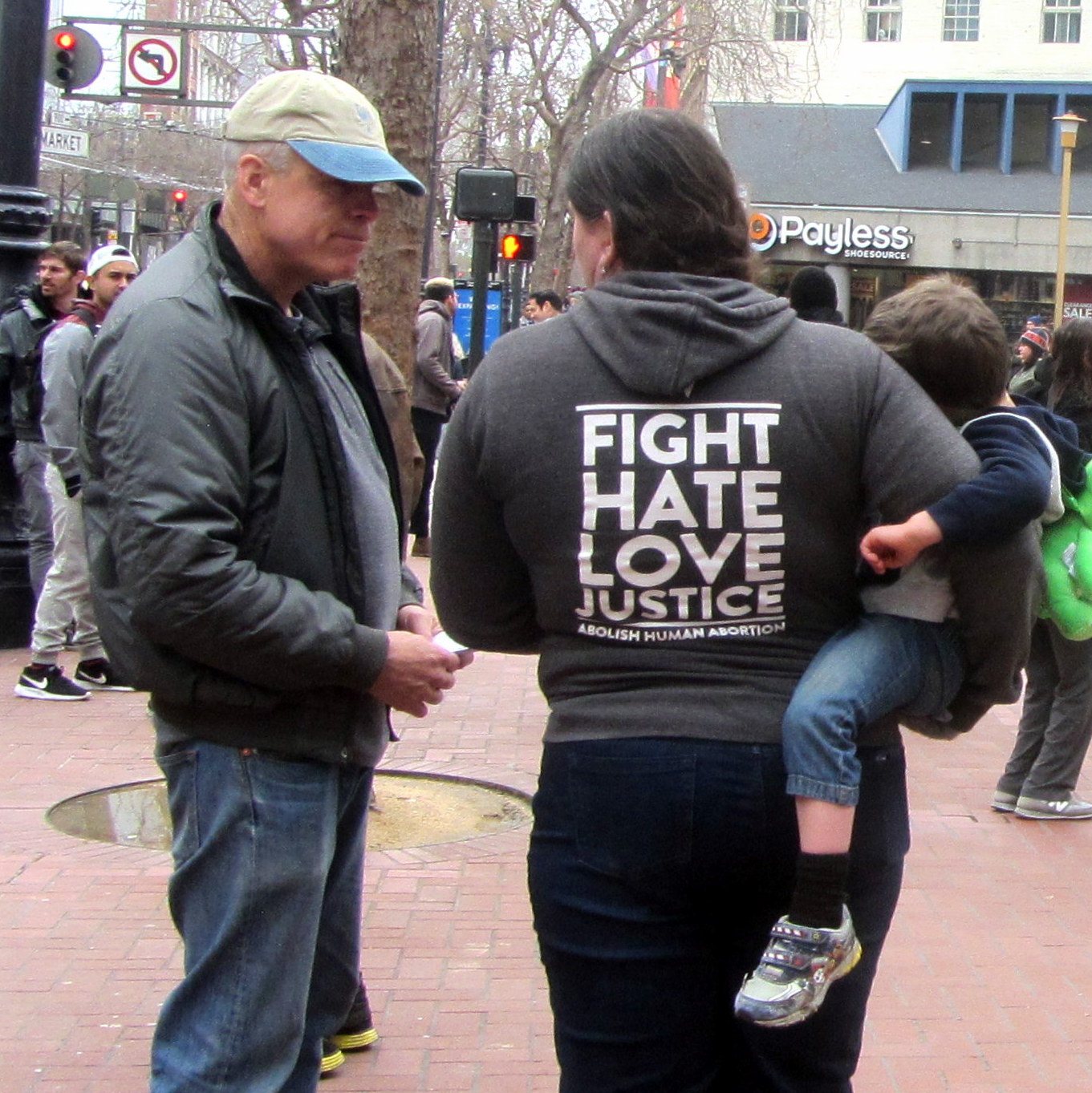 TOM WITNESSES TO PROTESTER AT ANTI-TRUMP WOMEN'S MARCH.