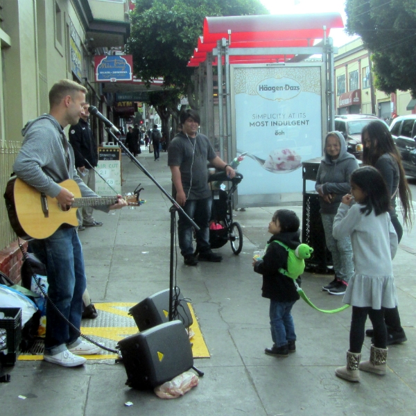 CAL SINGS AT 16TH AND VALENCIA.