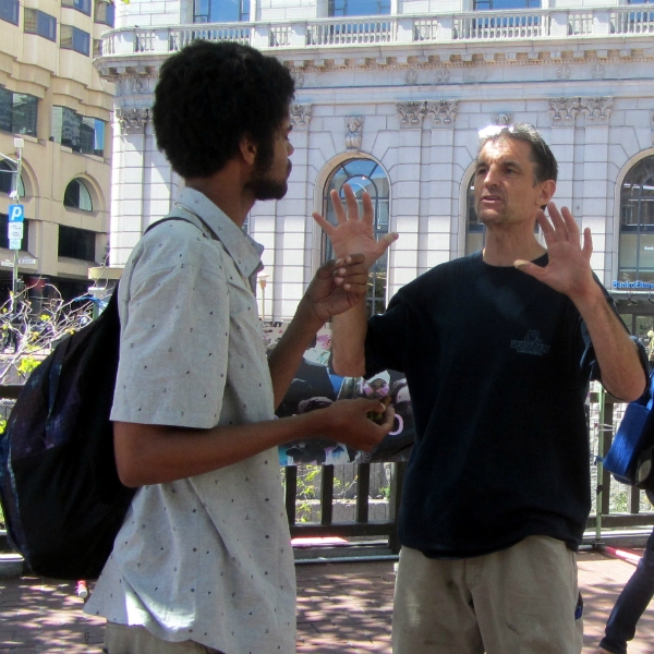 MIKE WITNESSES AT UN PLAZA.