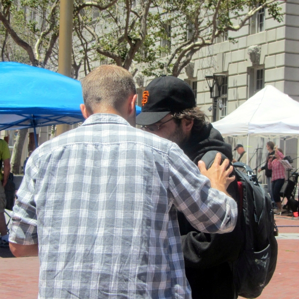 CAL PRAYS FOR MAN AT UN PLAZA