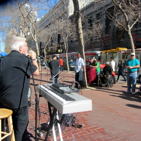 CHUCK GIRARD SINGS AT 5TH AND MARKET. 