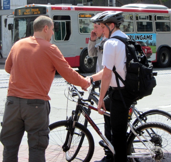 Andy witnesses to Mormon missionaries at 5th & Market. 