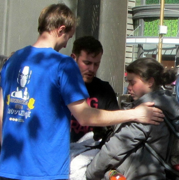 BEN AND EDDIE PRAY WITH WOMAN AT 5TH ST AND MARKET.