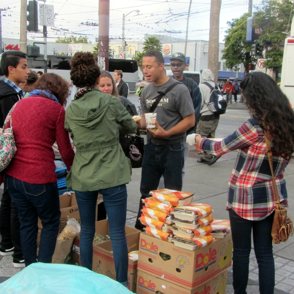 CASTILLO FAMILY GIVES OUT FOOD AT 16TH ST. AND MISSION.