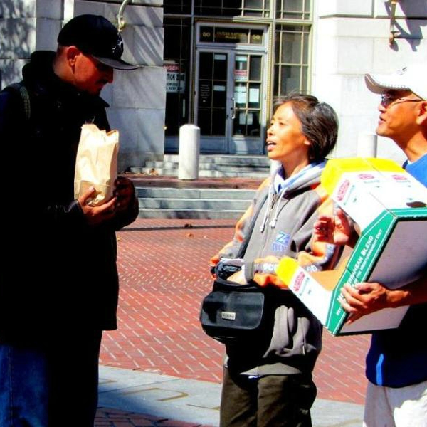 May and Loi give out food at UN Plaza. 