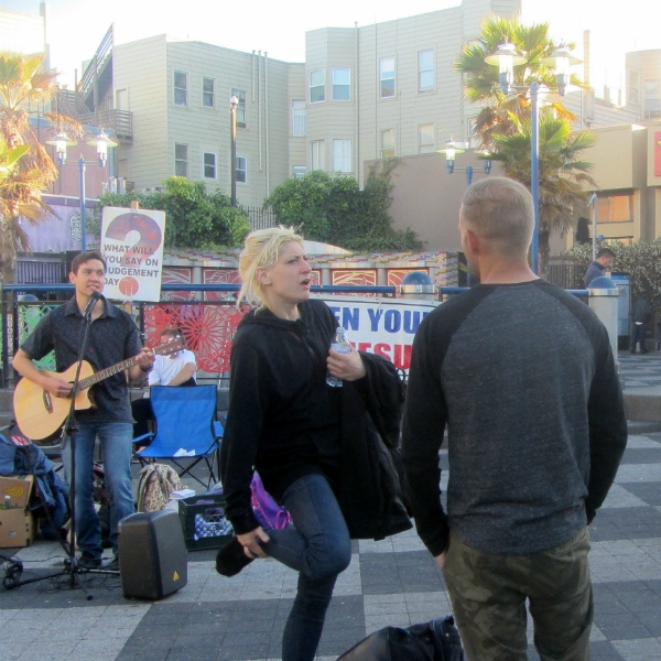 JAMES SINGS AT 24TH & MISSION WHILE CAL WITNESSES.