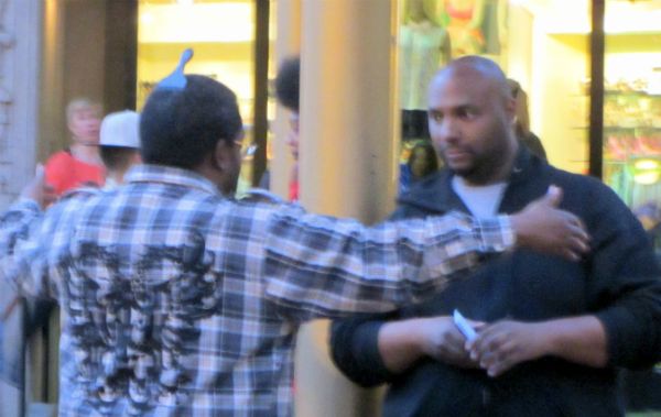 Isaiah (right) witnesses to man at Powell & Market