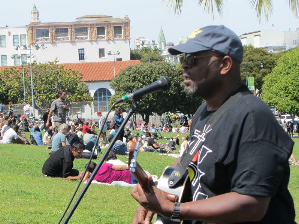Richard Griffin sings at Dolores Park on May 11