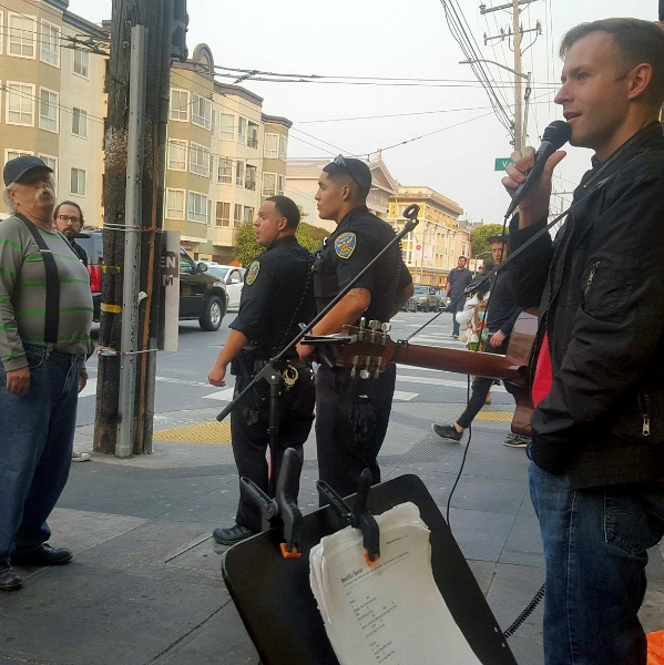 POLICE CONFRONT HECKLER AS CAL PREACHES AT 16TH AND VALENCIA
