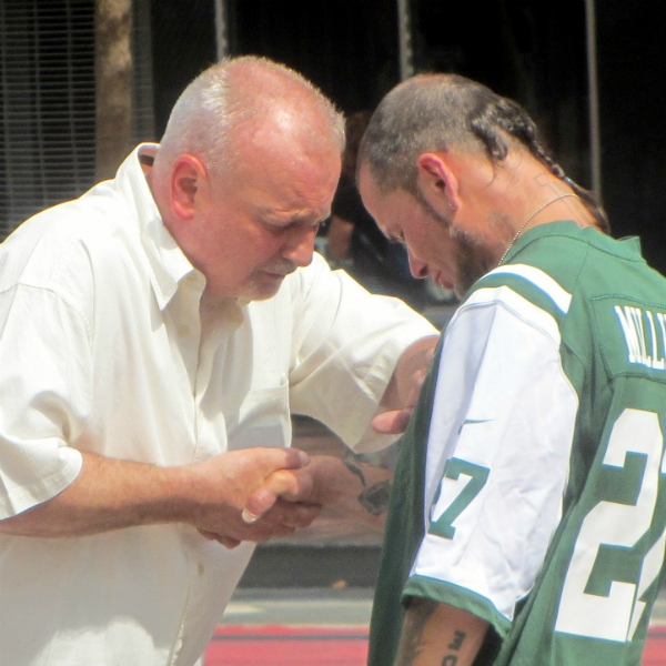 PASTOR BILL PRAYS FOR MAN AT UN PLAZA