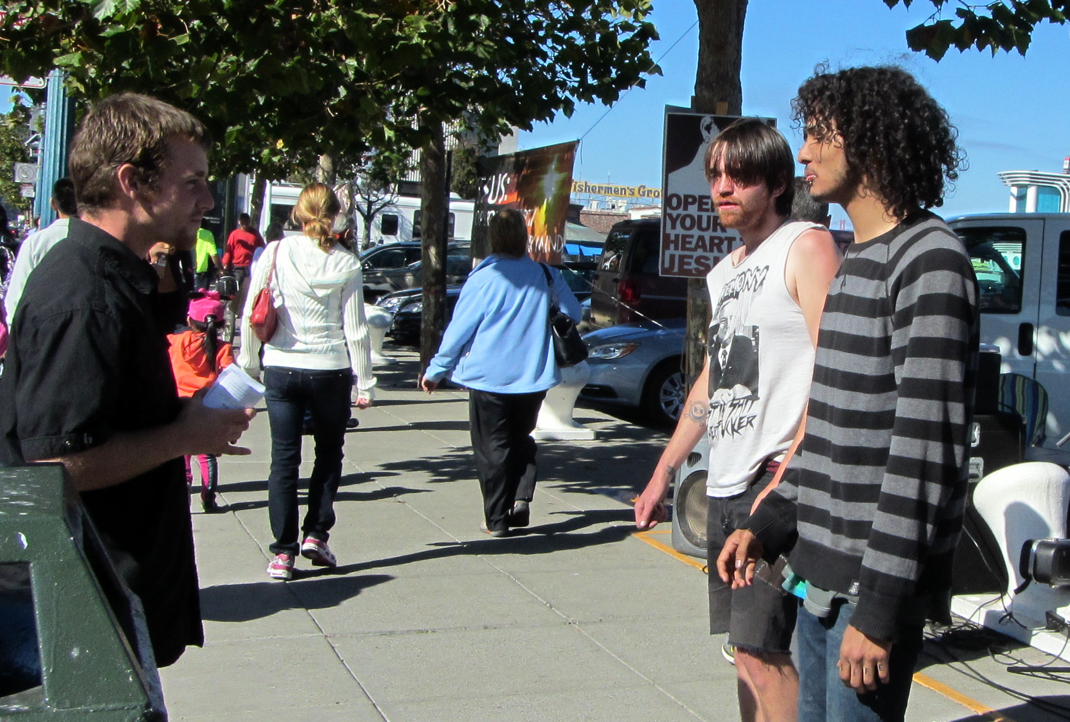 Eddie witnesses to two young men at Fisherman’s Wharf.