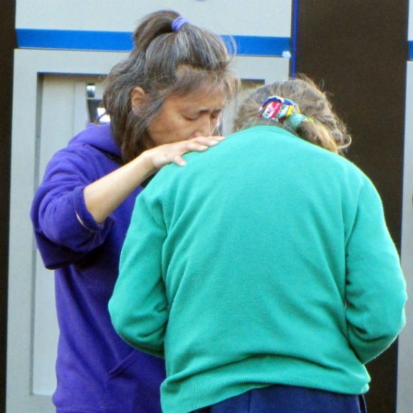 MAY PRAYS FOR WOMAN AT WHARF.