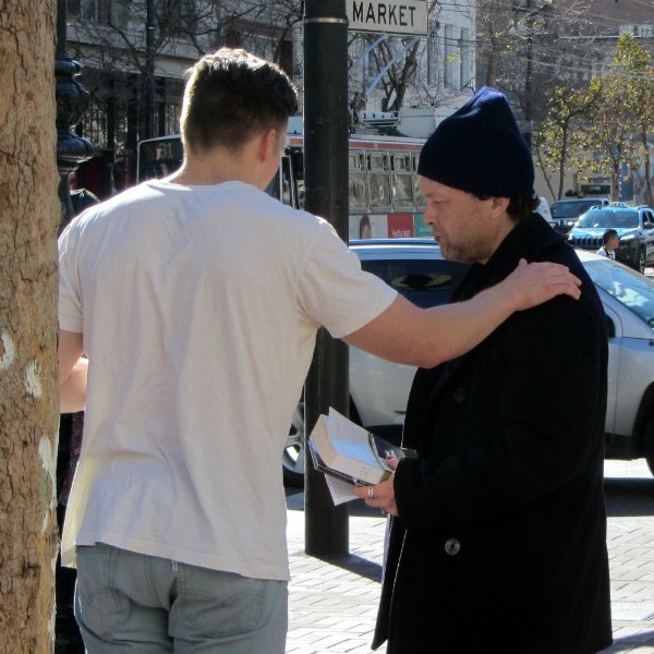 AMOS PRAYS FOR MAN AT 5TH AND MARKET