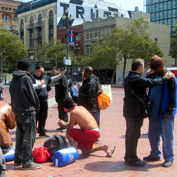 PRAYING FOR PEOPLE AT UN PLAZA