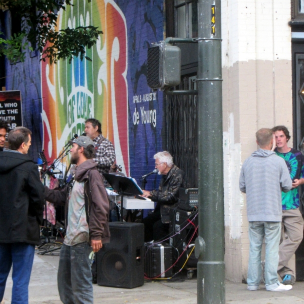 MIKE AND CAL WITNESS WHILE PAUL AND CHUCK SING ON HAIGHT ST.